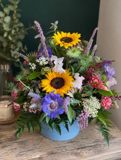 Summer Hatbox - Celebrate the beauty of the season with our Summer Meadow Hatbox, a naturally styled arrangement inspired by colourful wildflower meadows and sunny countryside gardens.