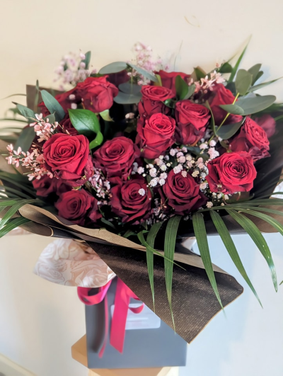 Timeless Romance - Elevate your expression of love and passion with our exquisite two dozen red roses bouquet. Symbolizing timeless romance and heartfelt affection, each vibrant red rose is carefully selected for its velvety petals and captivating beauty. Expertly arranged by our skilled florists, this classic bouquet exudes elegance and charm, making it the perfect gesture for anniversaries, Valentine's Day, or any occasion that calls for a declaration of love. Whether you're surprising a significant other or...