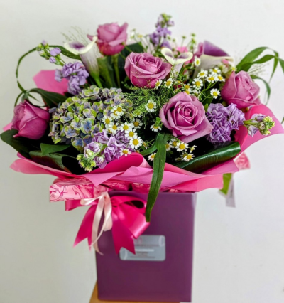 Lovely Lilacs - A cottage garden feel to this mix of roses and hydrangea in beautiful lilacs, purples and pinks.

Flowers may vary from day to day, please order in advance (at least 3 days) to garentee lilac roses